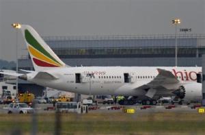 Emergency services attend to a Boeing 787 Dreamliner, operated by Ethiopian Airlines, after it caught fire at Britain's Heathrow airport
